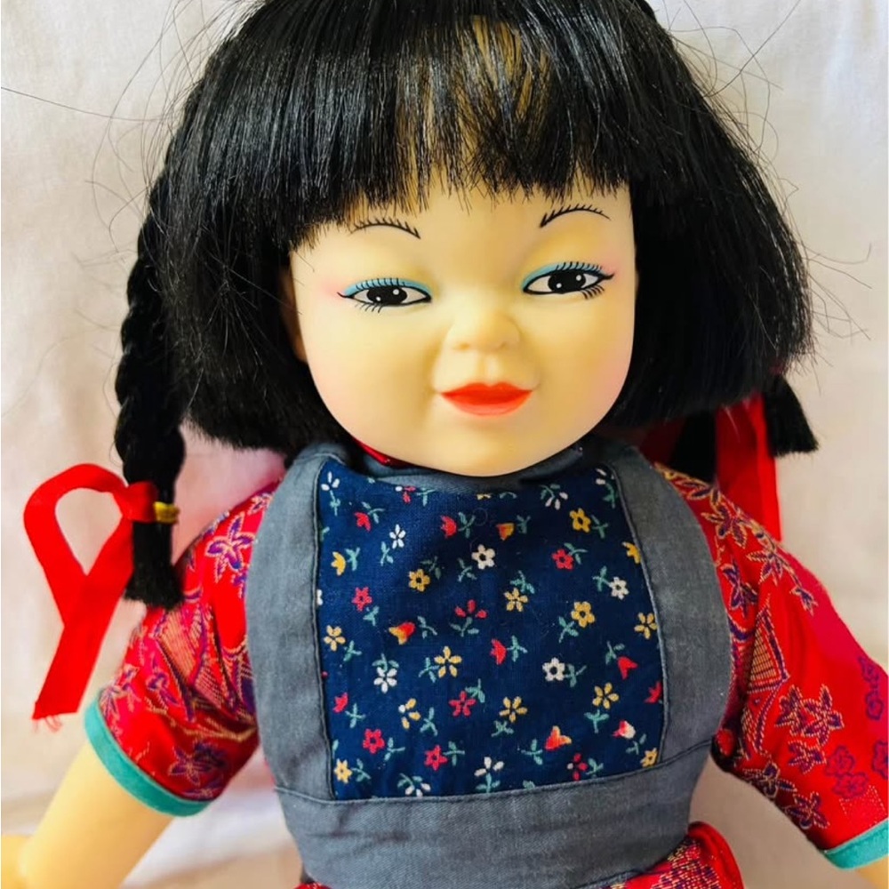 Traditional-Style Black-Haired Kids Doll with Floral Apron